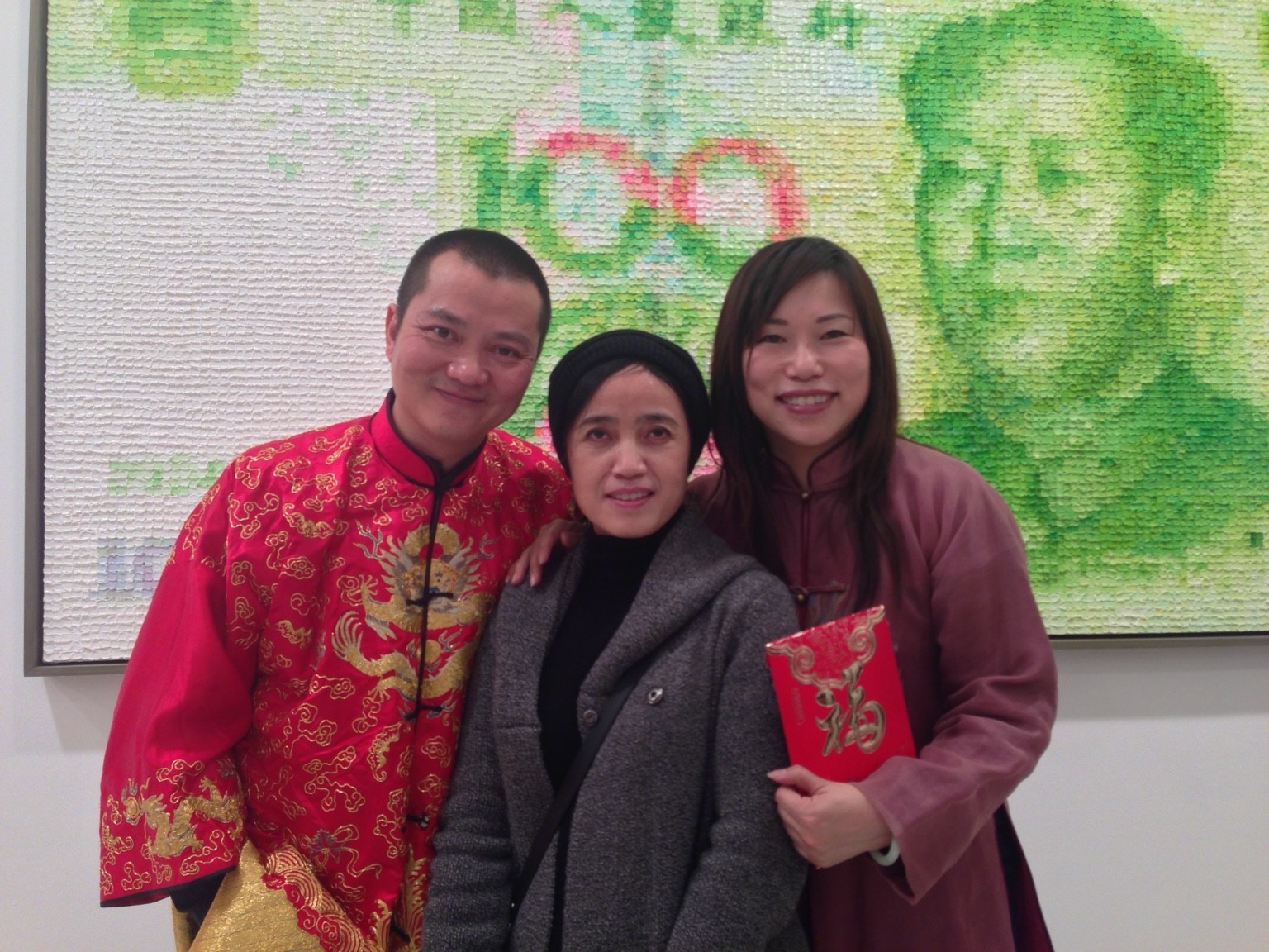 Together in front of the renminbi painting
